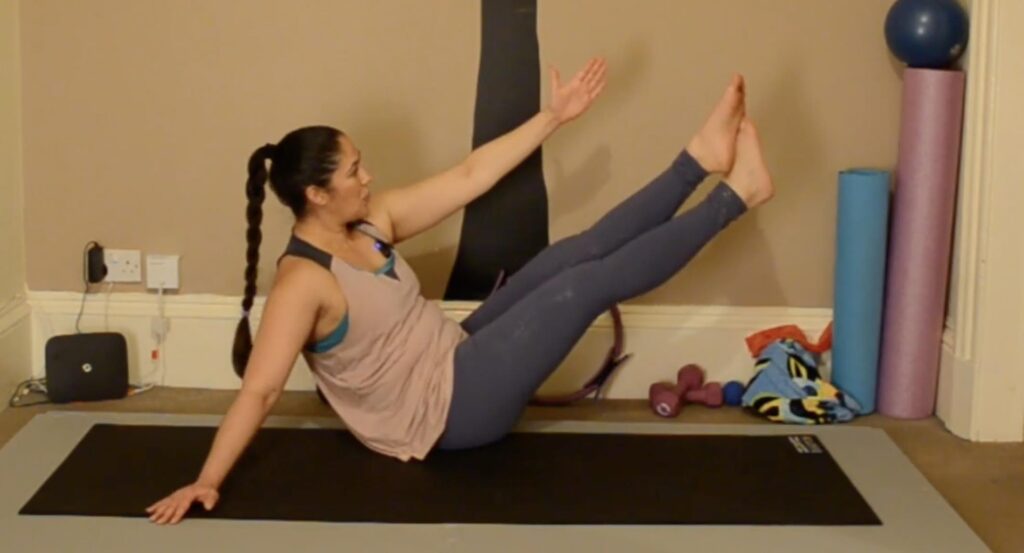 Paisley based Pilates Instructor, Ceza, doing a modified teaser.