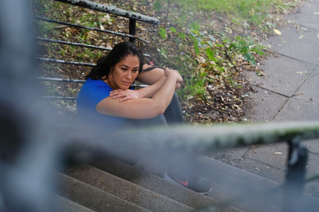 Woman looking sad as she realises all the relationship red flags.