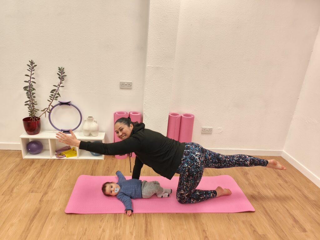 Pilates Instructor, Ceza, with her baby doing a mum & baby class. 