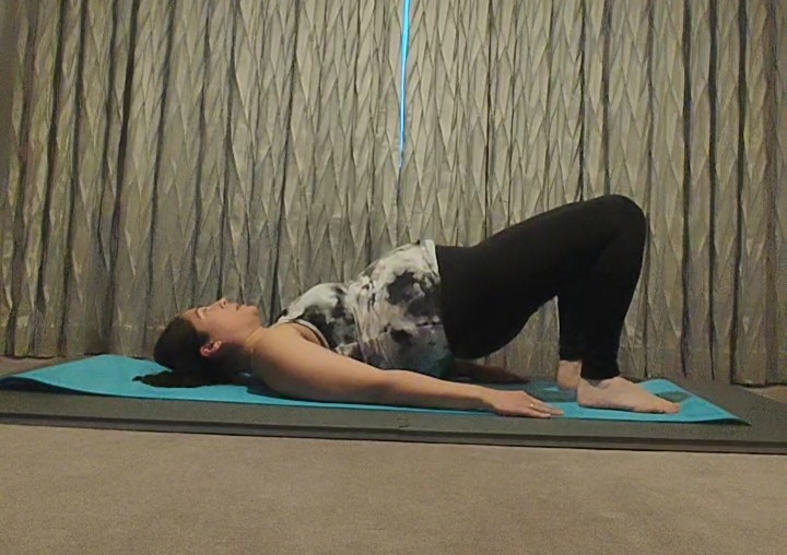 Pregnant woman doing shoulder bridge