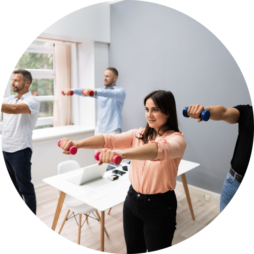 An office room doing exercise, lifting weights.